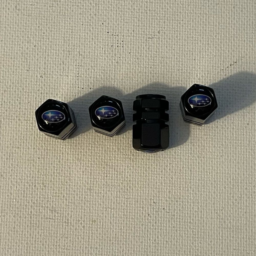 Subaru logo valve Stem caps in black set of 4 NWT